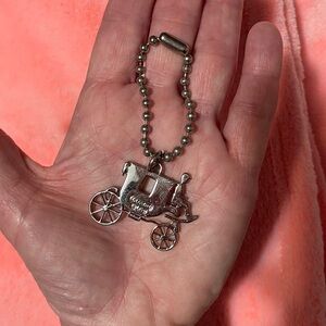 Authentic (Vintage) Coach, Carriage Keychain/ Purse Charm.
Silver colour Metal.